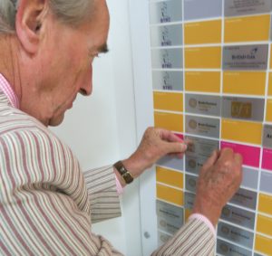 Mayor of K & C placing tile